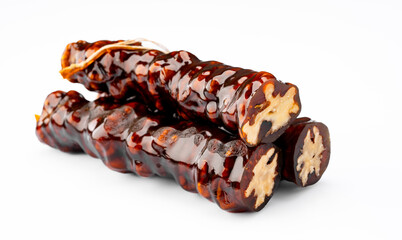 Walnut sausage dessert made with grape molasses and walnuts. Walnut sausage on white background