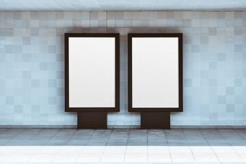Minimal modern interior with two blank vertical advertising lightboxes on tiled wall, clean geometry, copy space for posters or mockups, empty public passage, neutral daylight, symmetry and simplicity