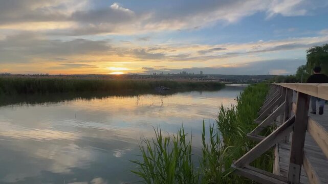 Lake view of G&ouml;lbaşı district, reflection of the lake and sky in the evening, Ankara, TURKEY
