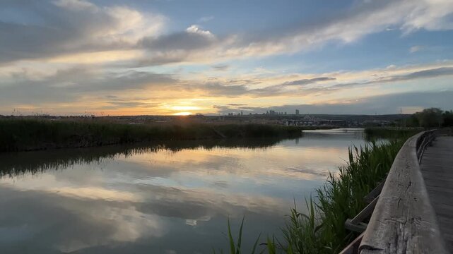 Lake view of G&ouml;lbaşı district, reflection of the lake and sky in the evening, Ankara, TURKEY