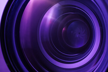 Obraz premium Closeup view of professional camera lens, toned in color. Photographer's equipment