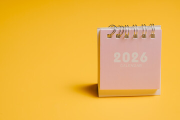 2026 calendar on yellow background with soft lighting and minimalistic style for planning and organization