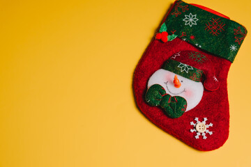 Christmas concept. Christmas stocking snowman decoration red and green holiday accessory festive ornament winter celebration seasonal decor smiling snowman