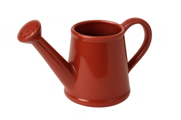 Red ceramic watering can for gardening and plant care, providing water and hydration for growing flowers, herbs