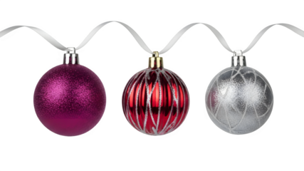 Three decorative christmas ornaments in various colors isolated on transparent background