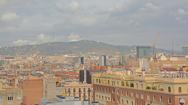 Aerial view on the city of Barcelona, and Tibidabo mountains in the background. Catalonia, Spain 