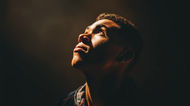 An evocative portrait of a young man, blending themes of light and human emotion.
