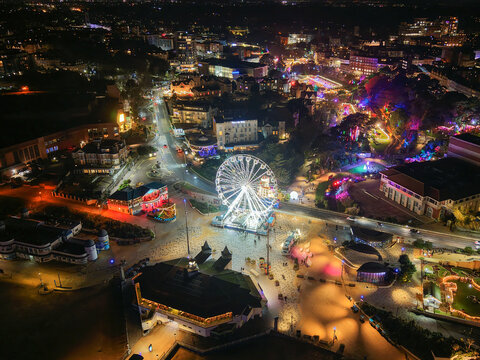 Aerial Night View of Bournemouth Winter Market with Ferris Wheel and Festive Lights, UK