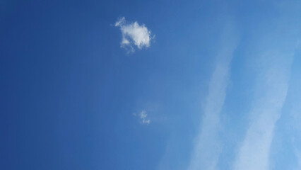 Minimal blue sky with small white cloud and copy space