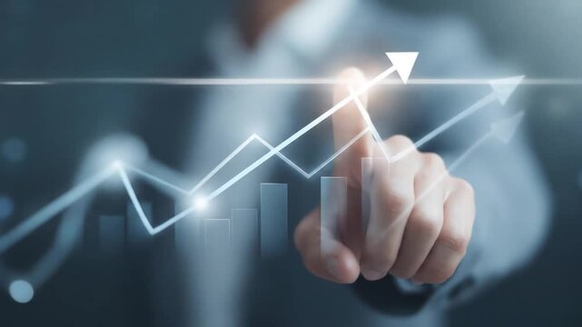 Businessman pointing at a digital growth graph and arrow