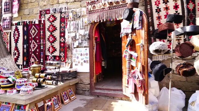 Antique stores in the old city, Baku, Azerbaijan.Antique tableware in the shop windows. Souvenirs for tourists on the streets of Baku Old city. Ancient jugs, paintings and other souvenirs