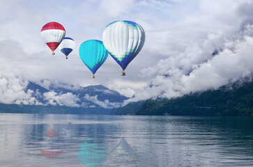 Fototapeta premium Colorful hot air balloons flying above sea