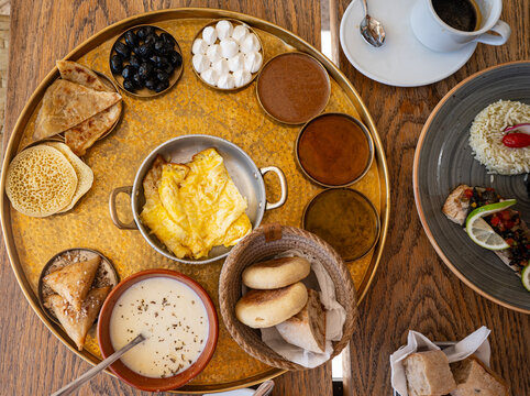 Traditional Moroccan Brunch Tray with Eggs, Bread and Tea