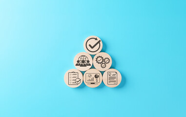 Quality assurance and certification compliance concept. Wood block showing icon of process control,...