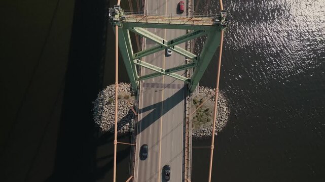 Top View Displays The Mackay Bridge In Nova Scotia Canada Spanning Across The Harbor Between Halifax And Dartmouth Under Sunny Summer Light Creating A Beautiful Coastal Transportation View