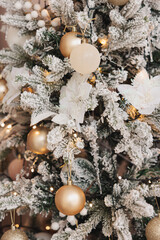 christmas background of white fir tree branches with golden balls and christmas lights. holiday background. new year. christmas tree.