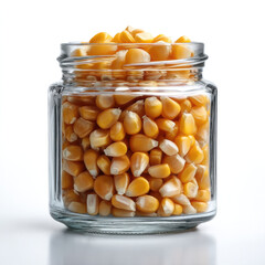 Corn kernels popcorn glass jar yellow food ingredient snack isolated closeup healthy
