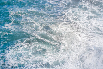 Fototapeta premium Abstract ocean water texture with waves and sea foam