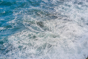 Fototapeta premium Abstract ocean water texture with waves and sea foam