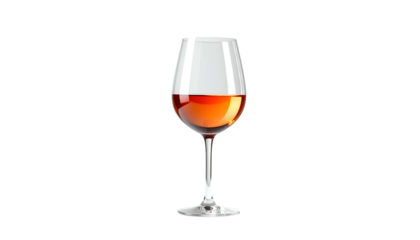 A crystal wine glass holds amber liquid against a stark black background