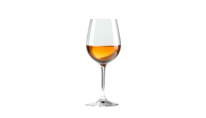 A wine glass, filled with amber liquid, stands alone against a stark black backdrop