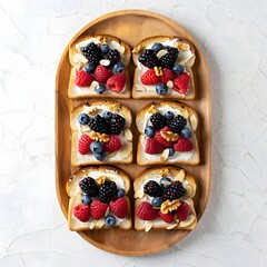 Six slices of toast with cream cheese and mixed berries