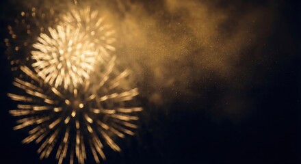 Explosion of golden fireworks illuminating the night sky