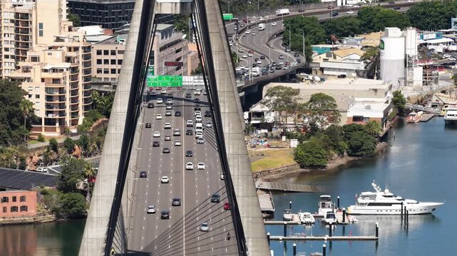 Close aerial view of motorway traffic on Anzac bridge in Sydney entering CBD.
