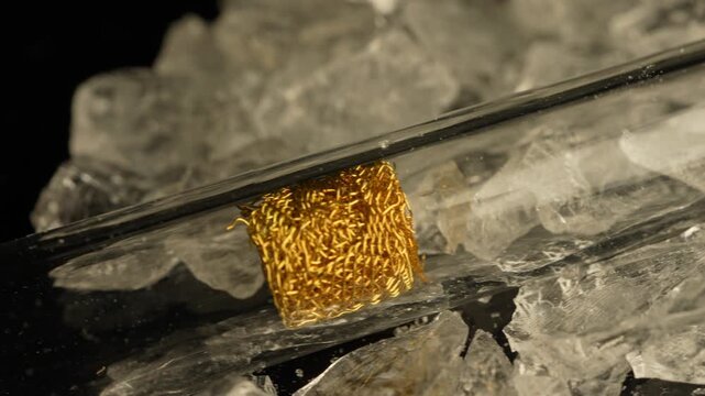 Crack cocaine drug in rocks or hard crystals with smoking crack pipe on the table. Illicit drugs very potent and addictive for sale in the streets and contribution to homelessness and addiction crises