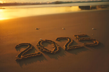 Number 2025 on the brown sand with foaming waves during golden hour