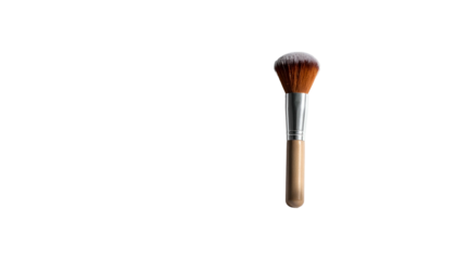 A makeup brush, handle downward, floats center-right on a stark black background