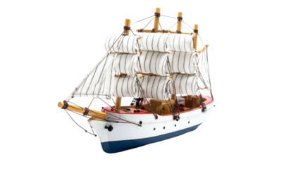 A small wooden replica of a sailing ship, complete with sails and intricate rigging