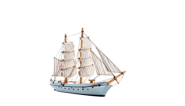 Model of a two-masted sailing ship with full sails, set against a black backdrop