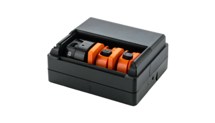 Black box with bright orange components and a hinged lid, angled on a dark background