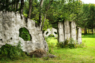 stone sculpture in forest  