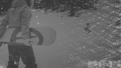 Snowboarder hold snowboard  presents black and white style with a textured background. Winter...