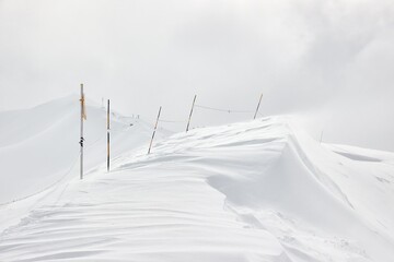 Winter high mountains in clouds