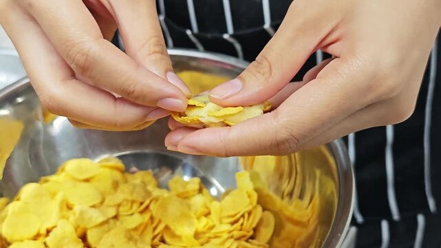 Handcrafted cornflake cookies being shaped to look crispy, golden, and irresistibly delicious.