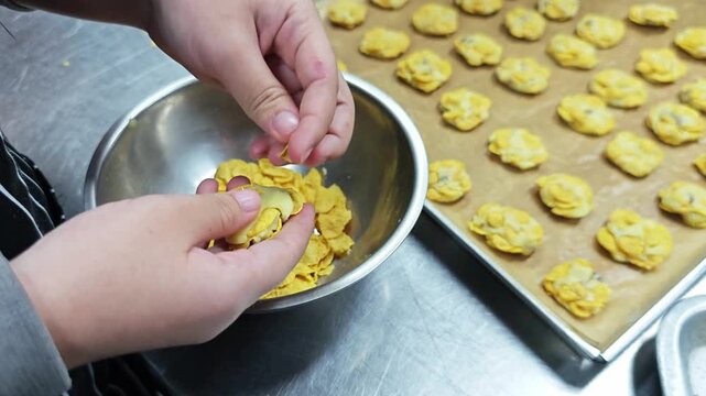 Handcrafted cornflake cookies being shaped to look crispy, golden, and irresistibly delicious.
