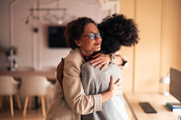 Warm Embrace Between Friends In Modern Office Setting Celebrating Support And Connection At Work