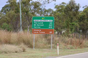 Road sign along the Gregory Developmental Road with distances to The Lynd, Mt Garnet, Cairns and the Undara Lava Tubes in Queensland, Australia