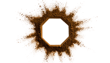 Abstract image of a brown explosion surrounding an octagonal frame on a black background