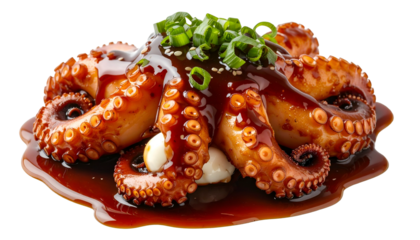 Cooked octopus dish with sauce, scallions and sesame, arranged artfully