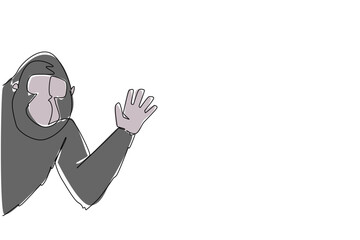 Obraz premium Continuous line drawing of a gorilla waving hand behind the wall, built with a nature concept and the theme animal waving hand, ideal for International Primate Day artistic celebration design.