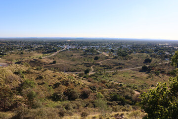 Sweeping view of Charters Towers with dry grass and scattered trees from the Towers Hill Lookout in Queensland, Australia