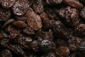 Obraz premium Black raisins close up studio shot over