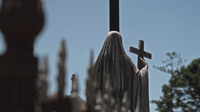 Stone Statue with Cross in Recoleta Cemetery