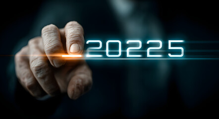 Progress Towards 2026 - Businessman interacting with a progress bar showing advancement from 2025 to 2026. Future planning concept