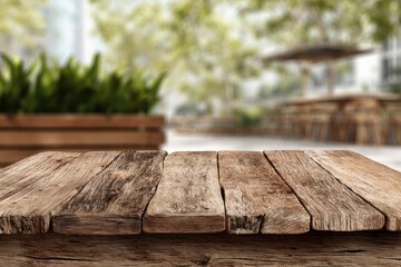 Wooden table outdoors. Blurred background of garden