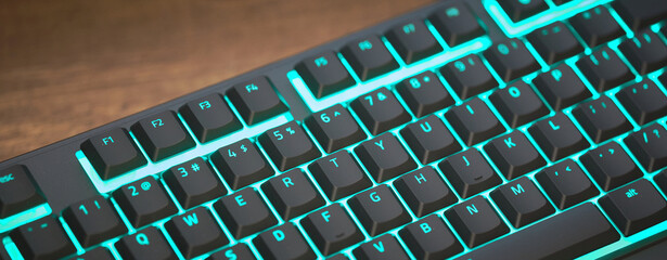 gaming keyboard with colorful RGB LED backlighting across the mechanical switches